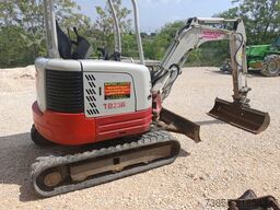 Takeuchi TB23R with 3 excavator buckets