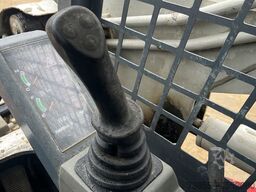 Takeuchi TL130 with forks and loader bucket