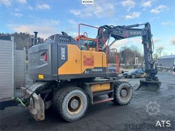 Volvo EW160E wheeled excavator with rototilt and two buc