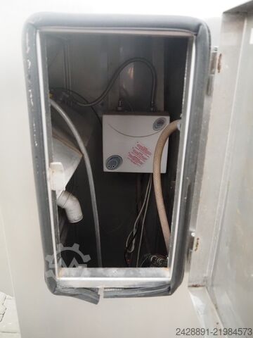 Hand disinfection station with turnstile  