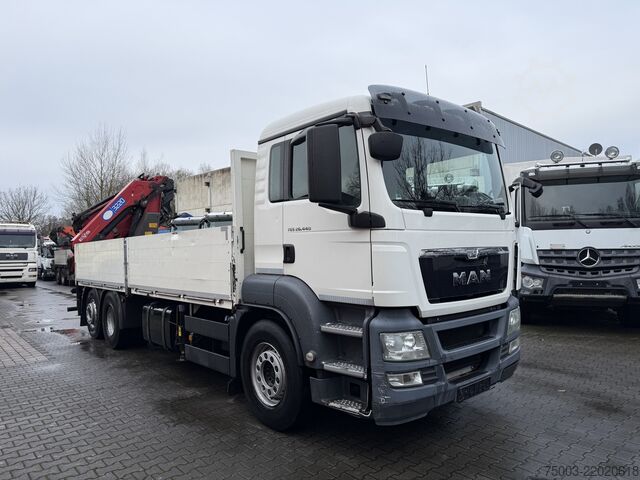 Flatbed truck MAN TGS 26.440 6X2-4 Kran HMF 3220 bis 29 Meter