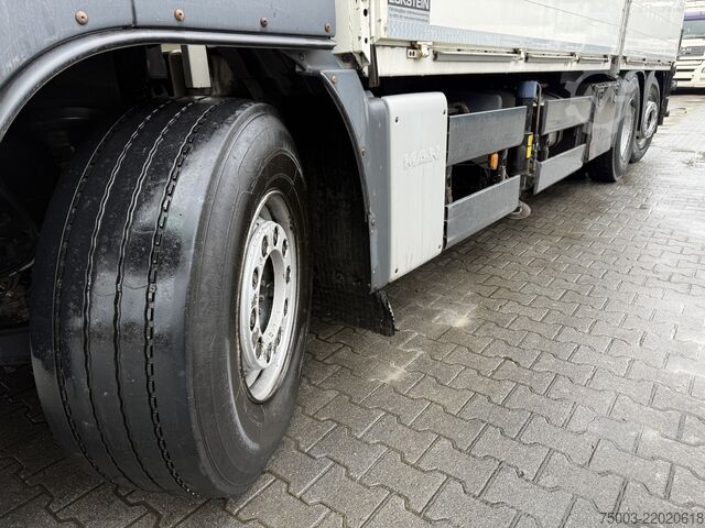 Flatbed truck MAN TGS 26.440 6X2-4 Kran HMF 3220 bis 29 Meter