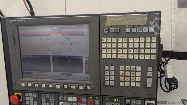 CNC lathe with bar feeder OKUMA L300-MW