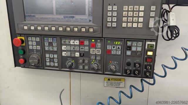 CNC lathe with bar feeder OKUMA L300-MW