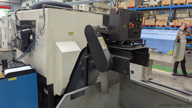 CNC lathe with bar feeder OKUMA L300-MW