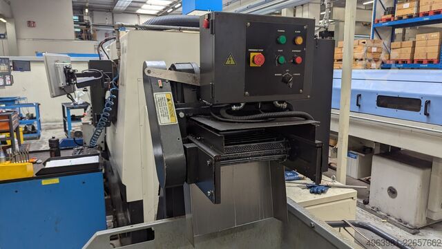CNC lathe with bar feeder OKUMA L300-MW