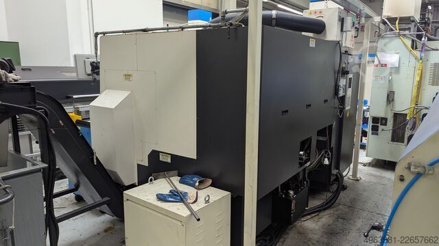 CNC lathe with bar feeder OKUMA L300-MW