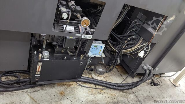 CNC lathe with bar feeder OKUMA L300-MW