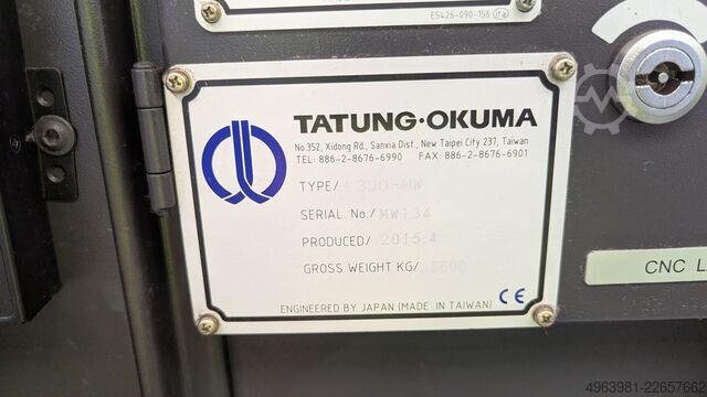 CNC lathe with bar feeder OKUMA L300-MW