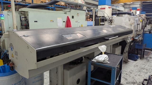 CNC lathe with bar feeder OKUMA L300-MW