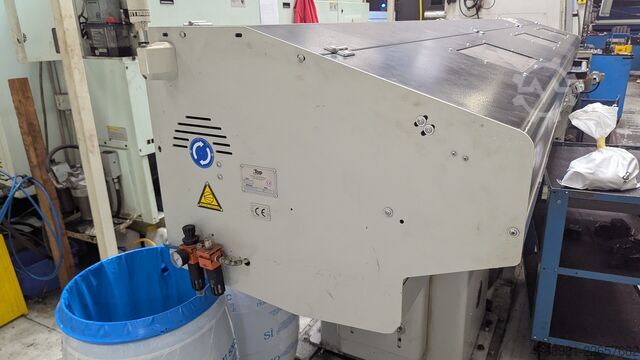 CNC lathe with bar feeder OKUMA L300-MW