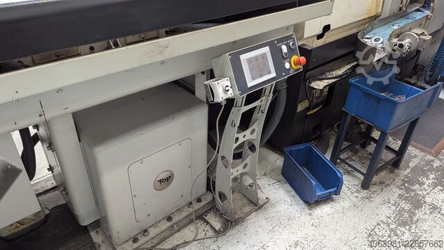 CNC lathe with bar feeder OKUMA L300-MW