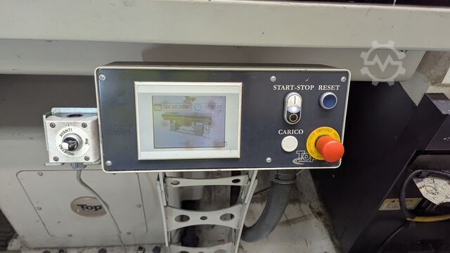 CNC lathe with bar feeder OKUMA L300-MW