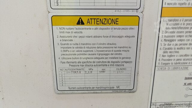 CNC lathe with bar feeder OKUMA L300-MW