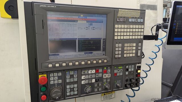 CNC lathe with bar feeder OKUMA L300-MW