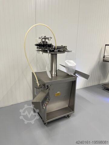 Bag filling and sealing machine H. Jouhsen Bag filling and sealing machine