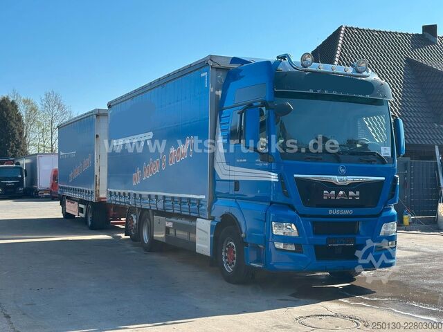 Flatbed truck with tarp MAN TGX 26.440