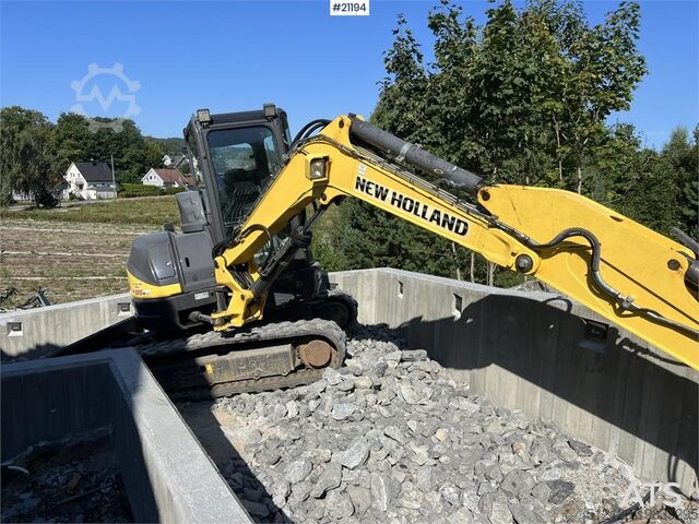 Crawler excavator New Holland E55B excavator w/ digging bucket, sanding bucket,