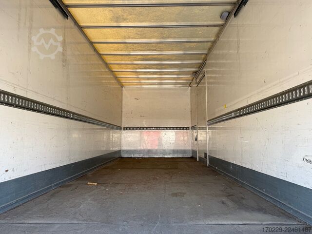 Truck with flatbed and retractable tail lift iveco eurocargo