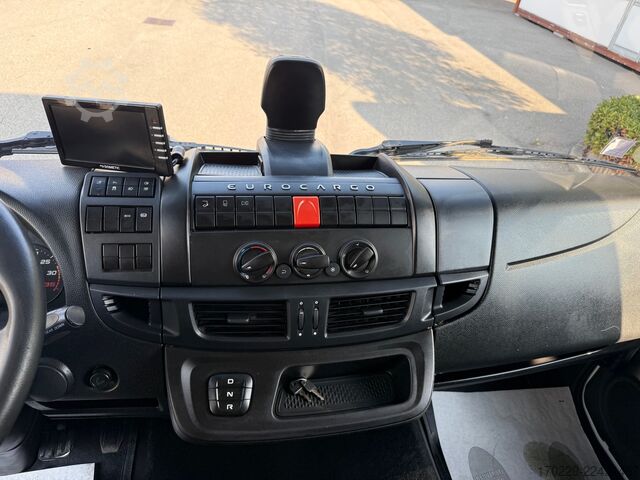 Truck with flatbed and retractable tail lift iveco eurocargo