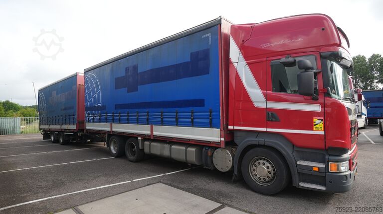 Sliding tarpaulin Scania R 400 6x2 curtainside in combo with Burg trailer