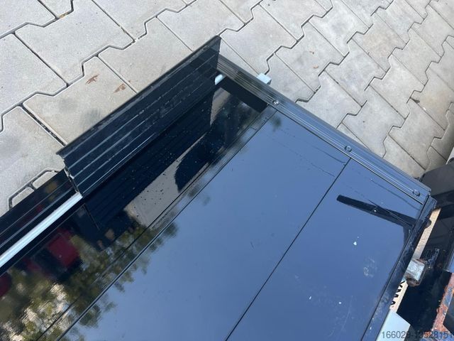 Auflieger-Wechselfahrgestell  Abrollcontainer mit Bordwänden