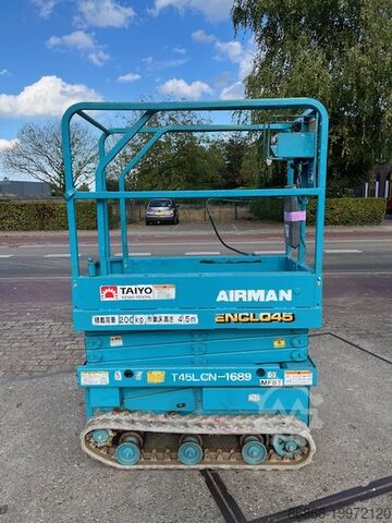 Gebrauchte Scherenarbeitsbühne auf Ketten Airman ENCL045 AIRMAN Encl.045