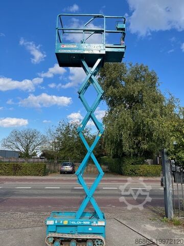 Gebrauchte Scherenarbeitsbühne auf Ketten Airman ENCL045 AIRMAN Encl.045