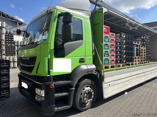 Flatbed truck with tarp IVECO Stralis AT
