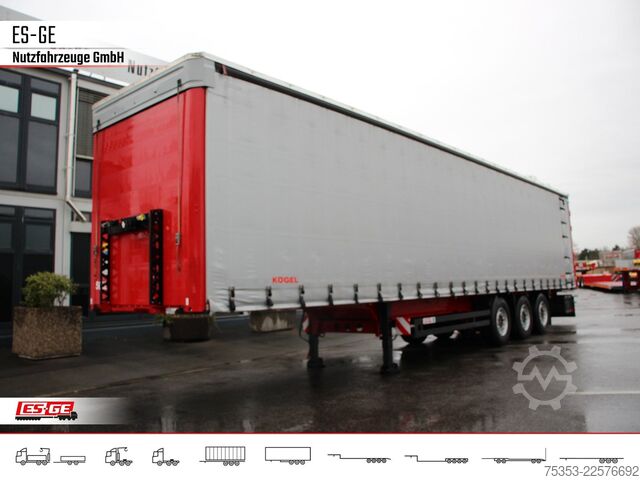 Open semitrailer with tarp KÖGEL 3-Achs-Cargo-Coil-Pritschensattelanhänger
