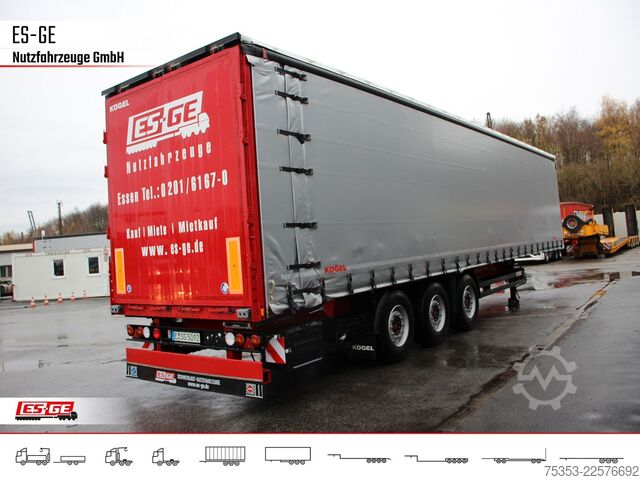 Open semitrailer with tarp KÖGEL 3-Achs-Cargo-Coil-Pritschensattelanhänger