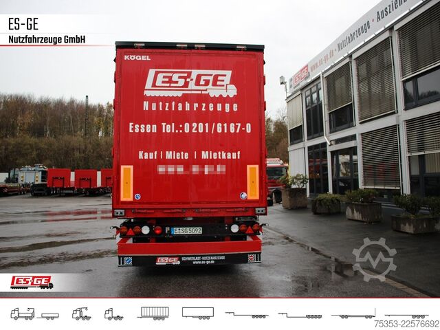 Open semitrailer with tarp KÖGEL 3-Achs-Cargo-Coil-Pritschensattelanhänger