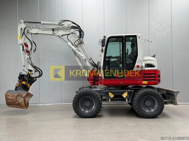 Wheel excavator Takeuchi TB 295 W Engcon Draaikantelstuk