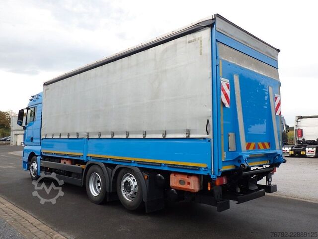 Flatbed truck with tarp MAN TGX 26.460 LL L-Fhs./Pritsche/LBW/Lenkachse/Ret.