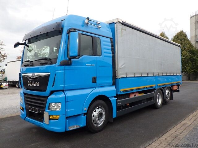 Flatbed truck MAN TGX 26.460 LL L-Fhs./Pritsche/LBW/Lenkachse/Ret.