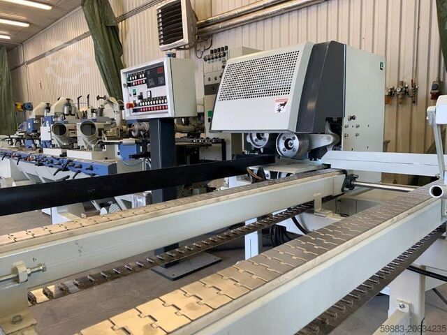 Material feeder for four-sided planer