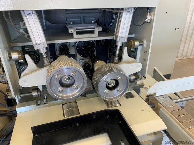 Material feeder for four-sided planer  