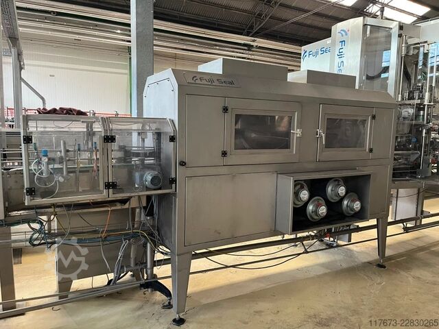 Used FUJI 410 sleeve applicator labeling machine for PET 10000 BPH Fuji Seal 410 DT-STH-DHA