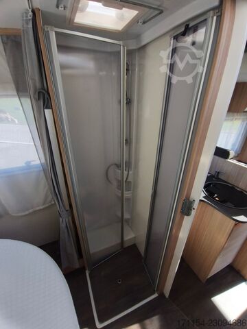 Teilintegriertes Wohnmobil SUNLIGHT T 69 S, Quensbett, SAT, Hubbett, Navi,1 Hand