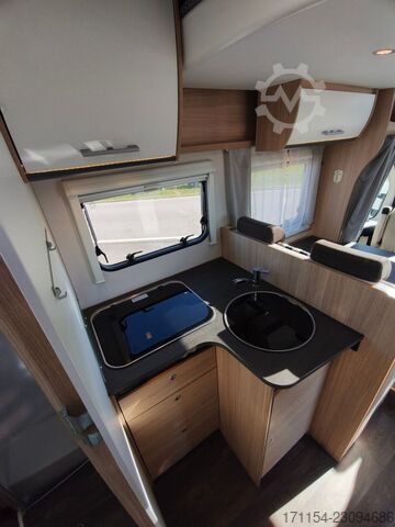Teilintegriertes Wohnmobil SUNLIGHT T 69 S, Quensbett, SAT, Hubbett, Navi,1 Hand