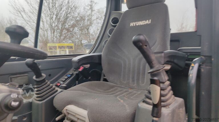 Mobilbagger Hyundai R55W-9A with 3 excavator buckets