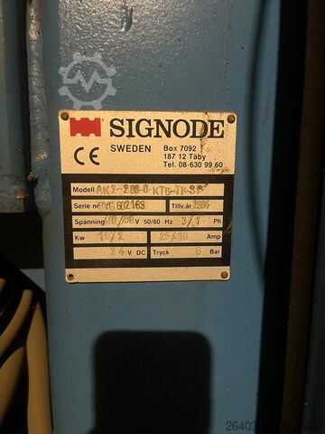 Pack press with plastic strappin Pack press Signode AK2-200