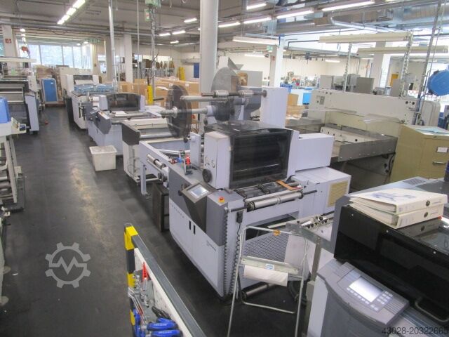 POST-PROCESSING SYSTEM HUNKELER Abwicklung, Stanzen, Wenden, Aufwicklung