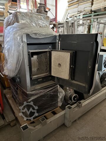 Heating system, wood chip heating Fröling Turbomatic TMC 35 kW + Raumaustragung