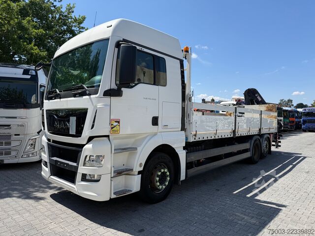 Flatbed truck MAN TGX 26.440 6X2 Kran Hiab 144