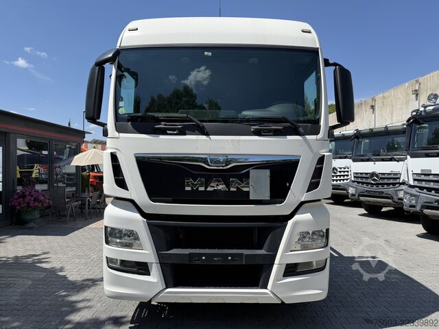 Flatbed truck MAN TGX 26.440 6X2 Kran Hiab 144