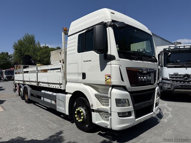 Flatbed truck MAN TGX 26.440 6X2 Kran Hiab 144