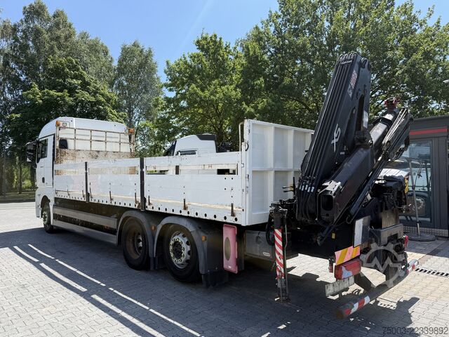Flatbed truck MAN TGX 26.440 6X2 Kran Hiab 144