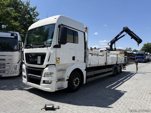 Flatbed truck MAN TGX 26.440 6X2 Kran Hiab 144