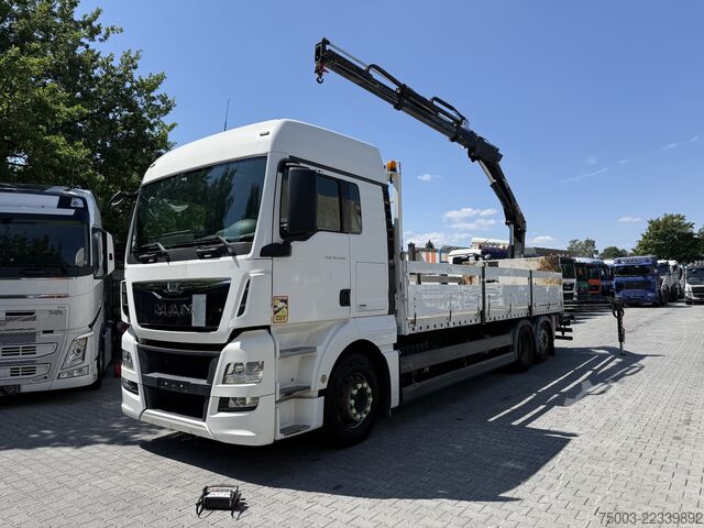 Flatbed truck MAN TGX 26.440 6X2 Kran Hiab 144